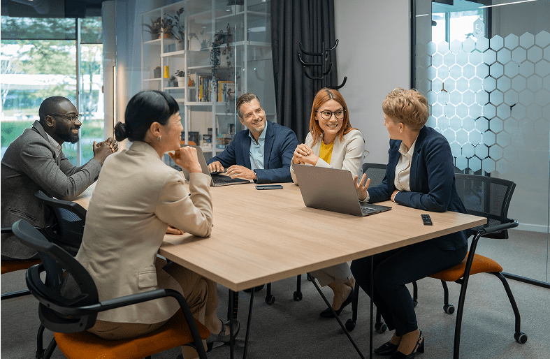 Business meeting with diverse group discussing ideas.