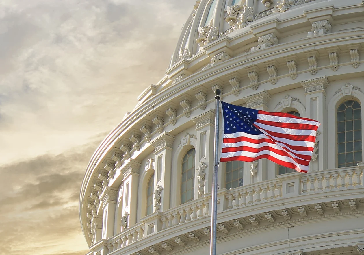 U.S. Capitol dome with American flag.